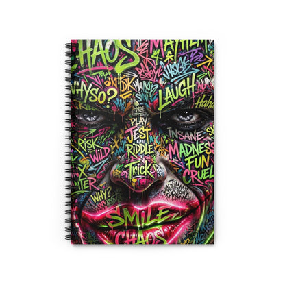 Spiral notebook with graffiti-style art featuring a face with words like "Chaos," "Laugh," and "Smile."