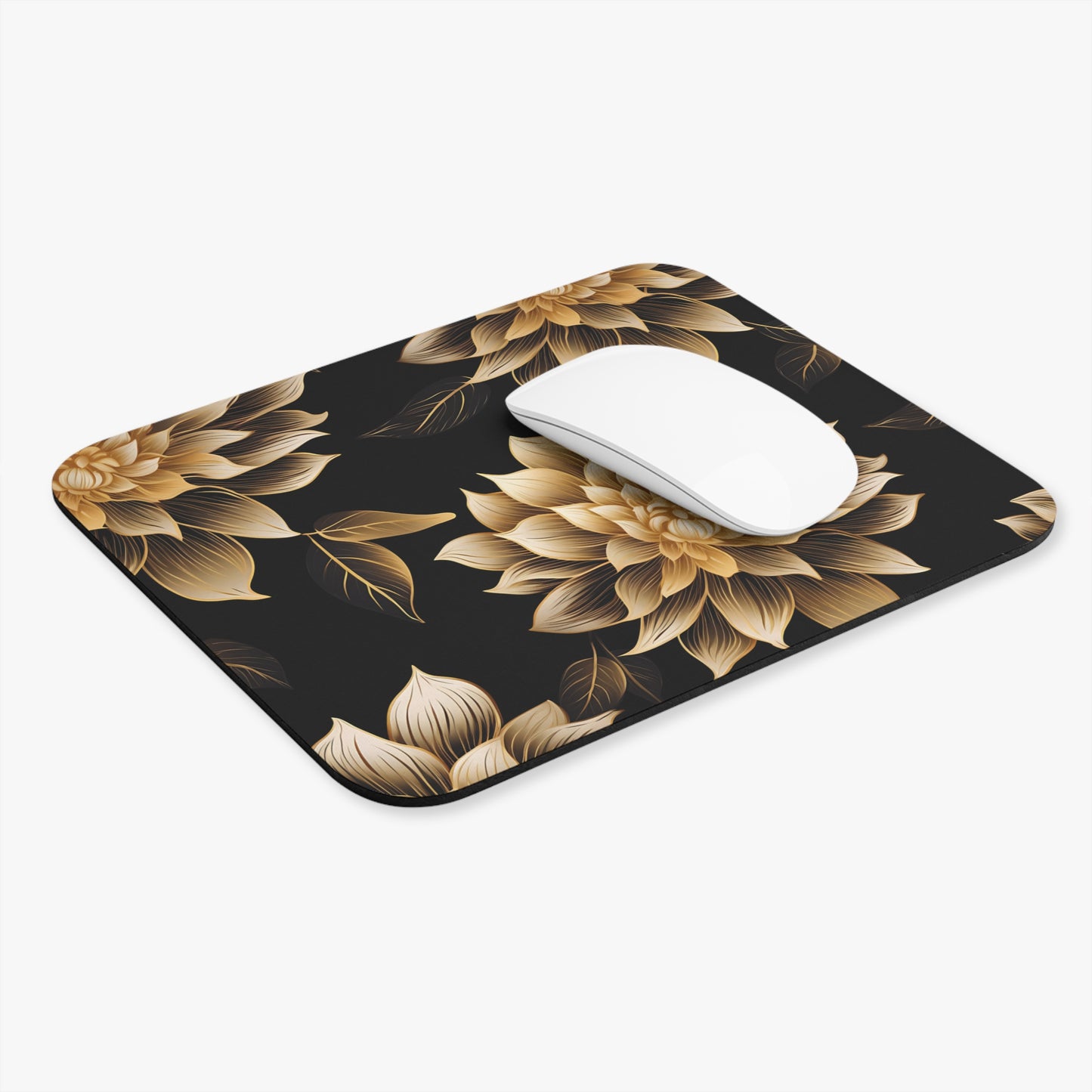 Black mousepad with gold floral pattern and a white mouse.