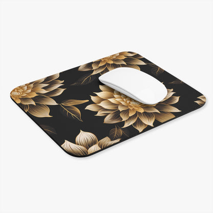 Black mousepad with gold floral pattern and a white mouse.