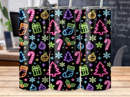 Three tumblers with a repeating neon Christmas pattern on a black background.