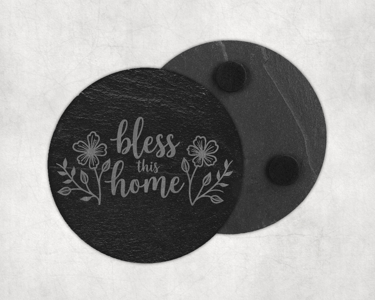 Slate coaster with etched floral design and "bless this home" text.