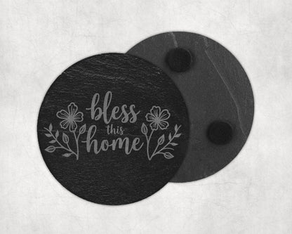 Slate coaster with etched floral design and "bless this home" text.