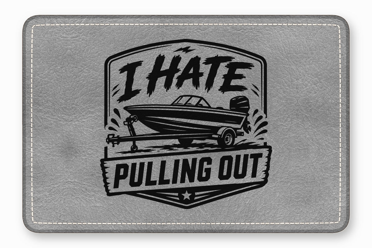 Gray textured faux leather rectangle with rounded, stitched corners and a black boat design bearing the text I HATE PULLING OUT.