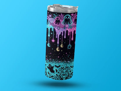 Tumbler with neon ghosts, moons, stars, bats, and glitter drip design.
