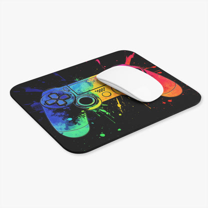 Gaming controller mousepad with colorful paint splatters and a white mouse.