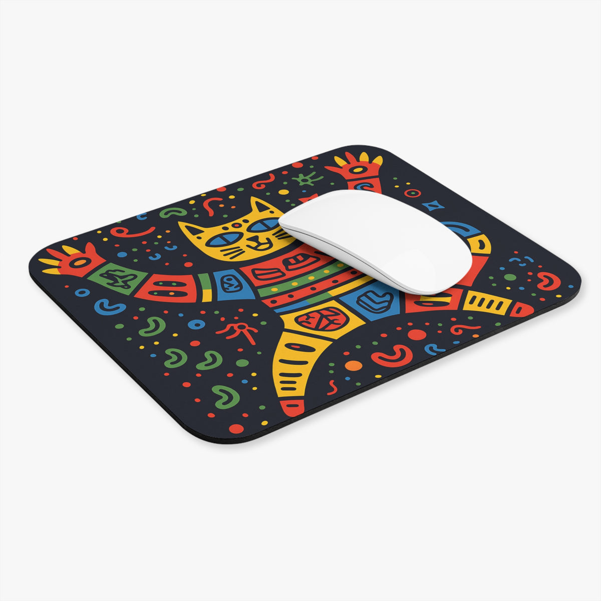 A rectangular mouse pad with a dark background and a colorful folk-art style cat illustration, featuring a white wireless mouse resting on top.