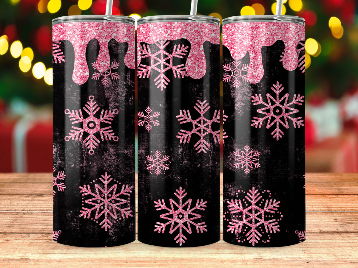 Three black tumblers with pink glitter drips and snowflakes on a wooden surface.