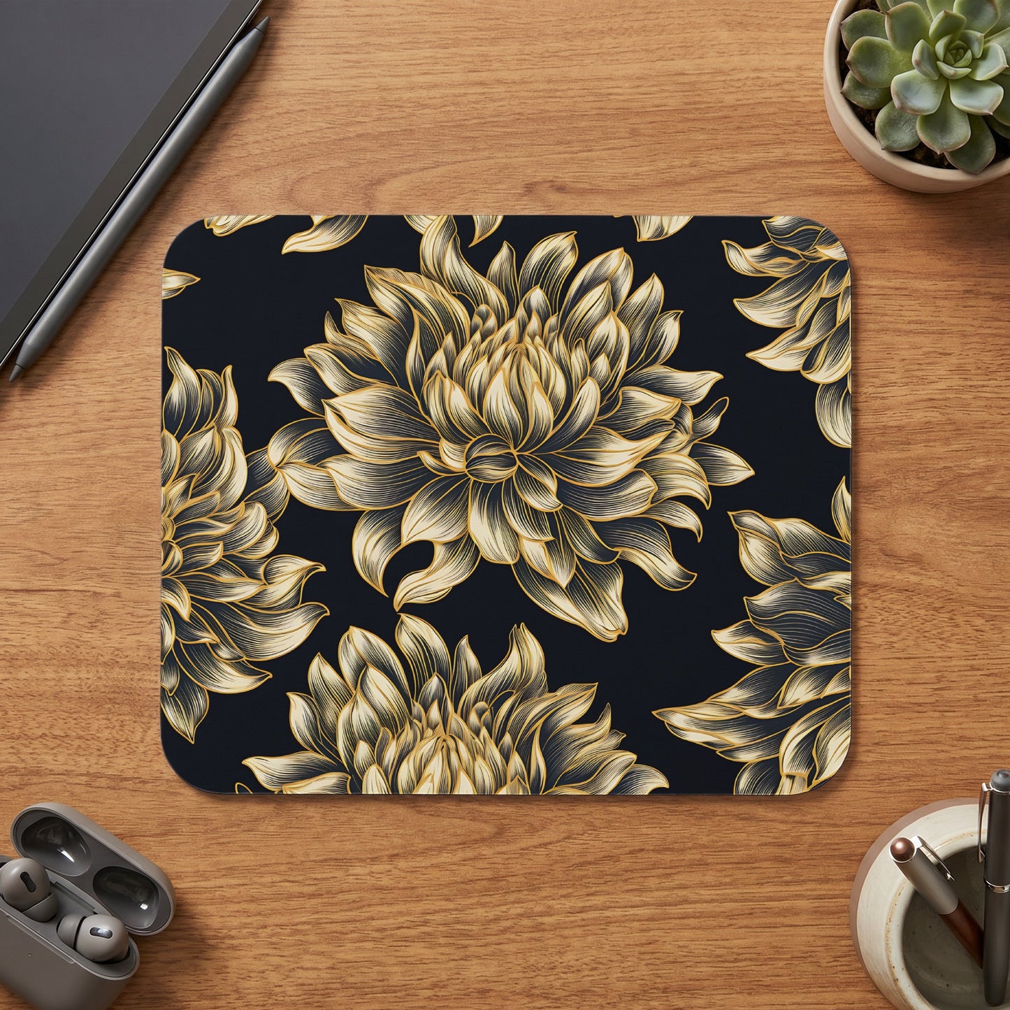 Dark mousepad with a repeating pattern of gold chrysanthemums on a black background.