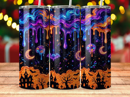 Three tumblers with a spooky Halloween design featuring dripping paint, moons, bats, and haunted houses.