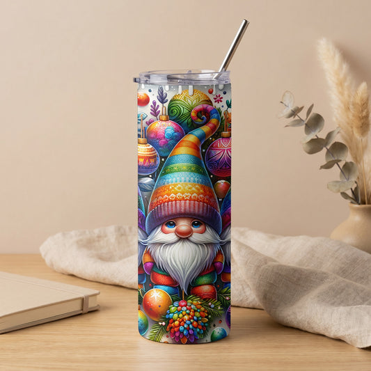 Tumbler featuring a gnome with a rainbow striped hat surrounded by colorful Christmas ornaments.