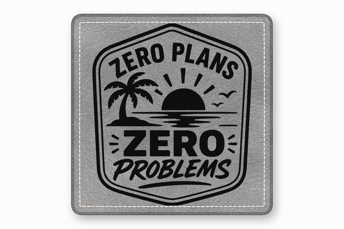 Square grey leatherette patch with stitched border, featuring a tropical sunset design and the text ZERO PLANS ZERO PROBLEMS.