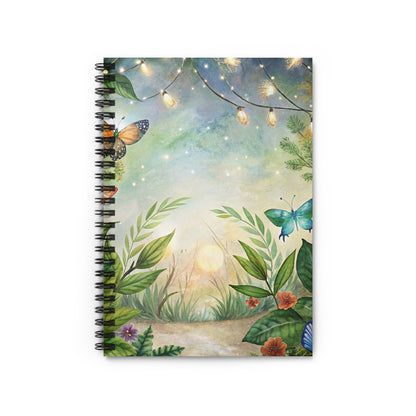 Spiral-bound notebook with a watercolor illustration of a forest path, butterflies, and string lights.