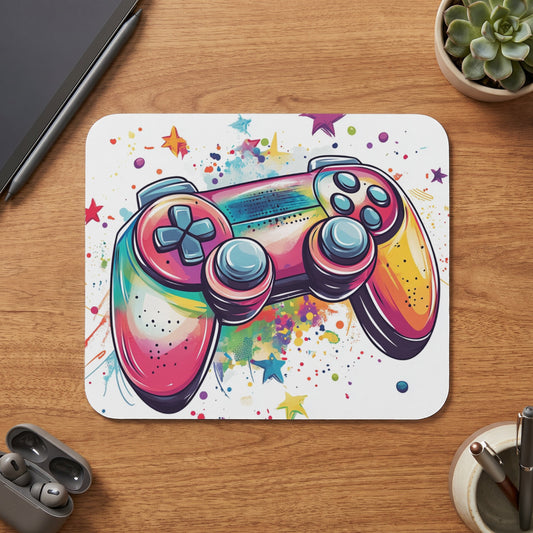 Colorful watercolor gaming controller with stars and paint splatters on a mousepad.