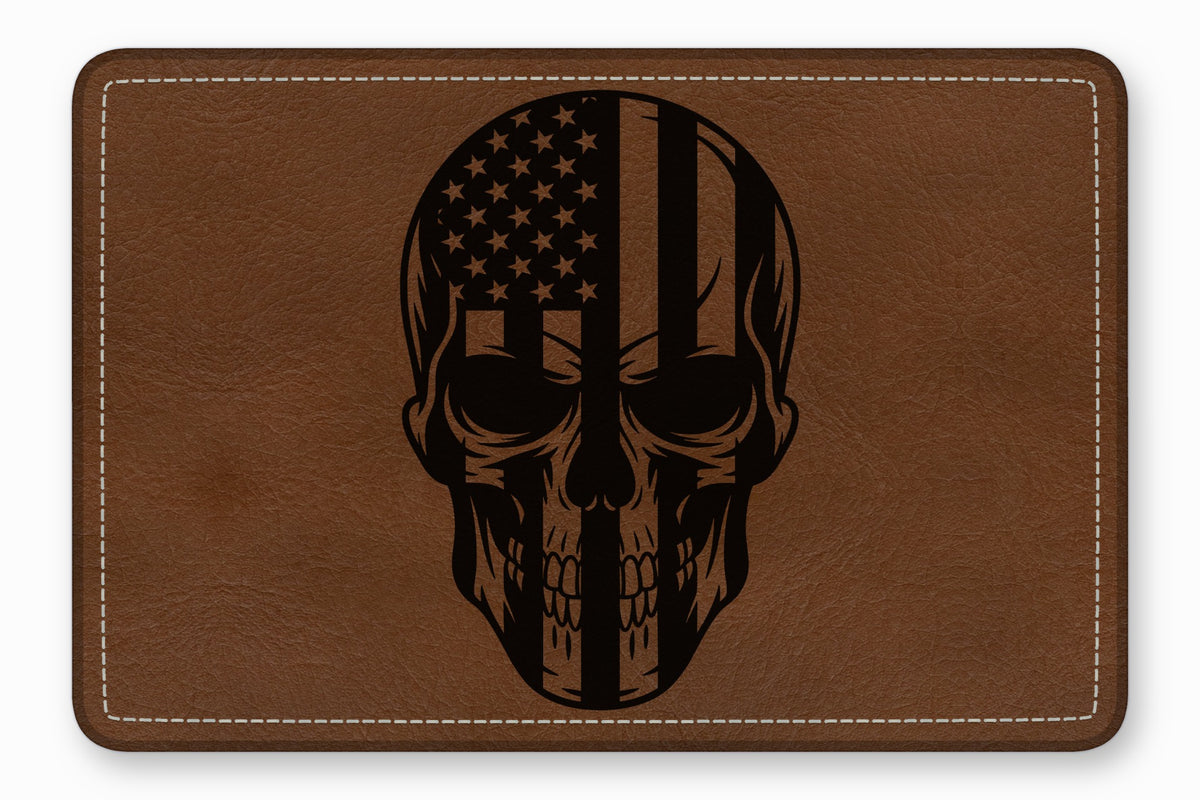 Brown leather patch with rounded corners and white stitching, featuring a black laser-engraved skull graphic.