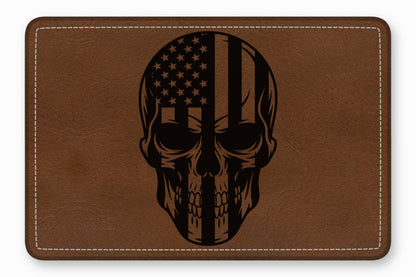 Brown leather patch with rounded corners and white stitching, featuring a black laser-engraved skull graphic.