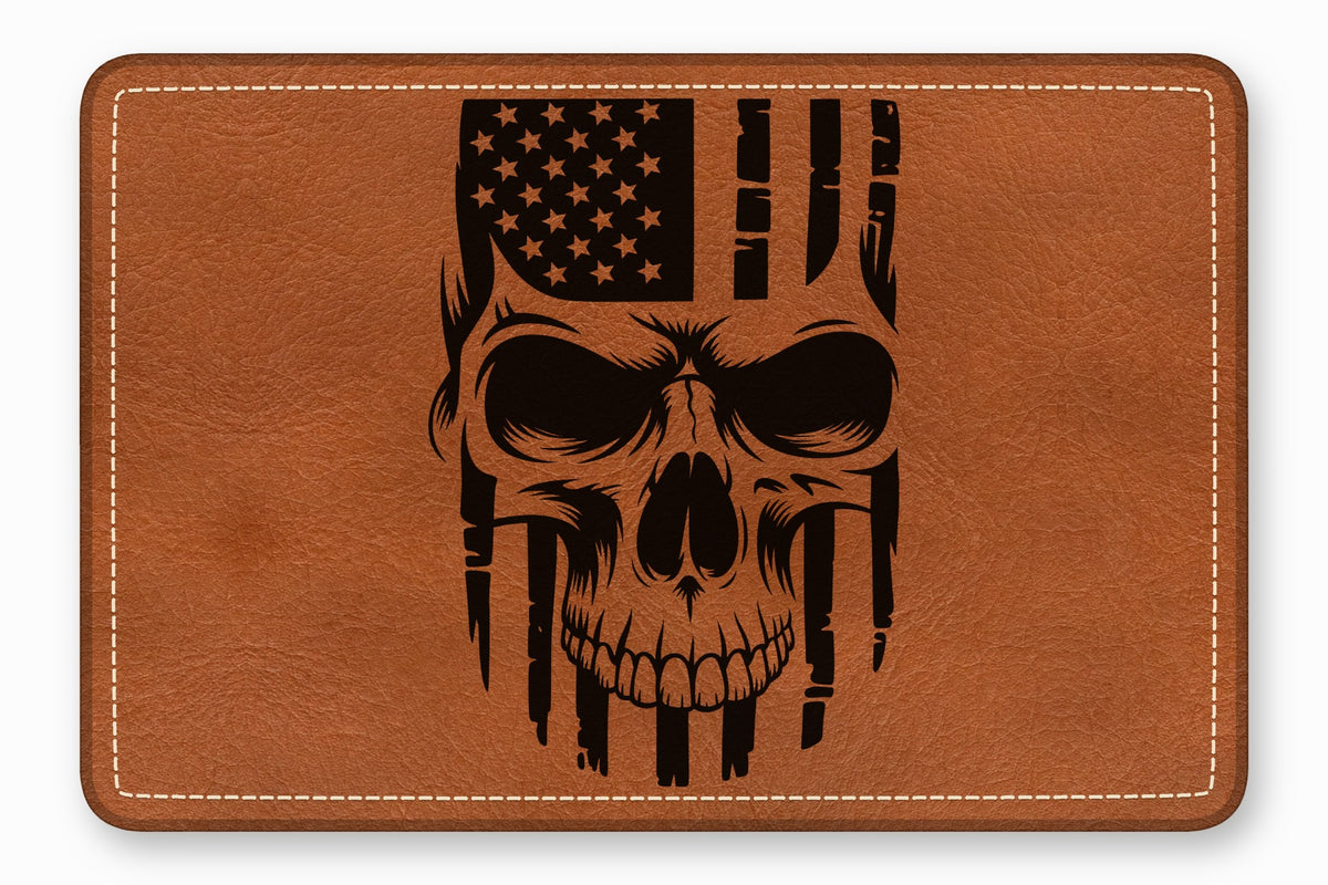 Tan leather patch featuring a black engraved skull graphic combined with the American flag.