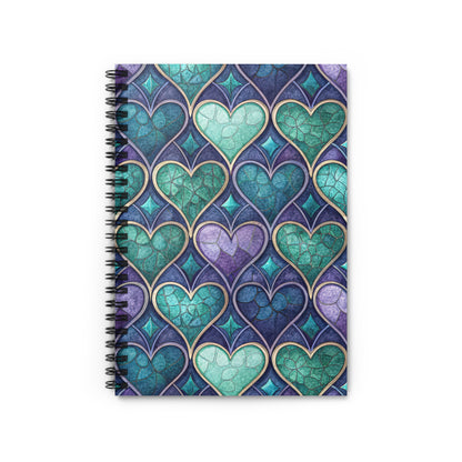Spiral-bound notebook with a stained-glass heart pattern in blue, teal, and purple.