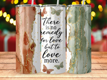 Three tumblers with marble and glitter designs featuring butterflies and the quote "There is no remedy for love but to love more."