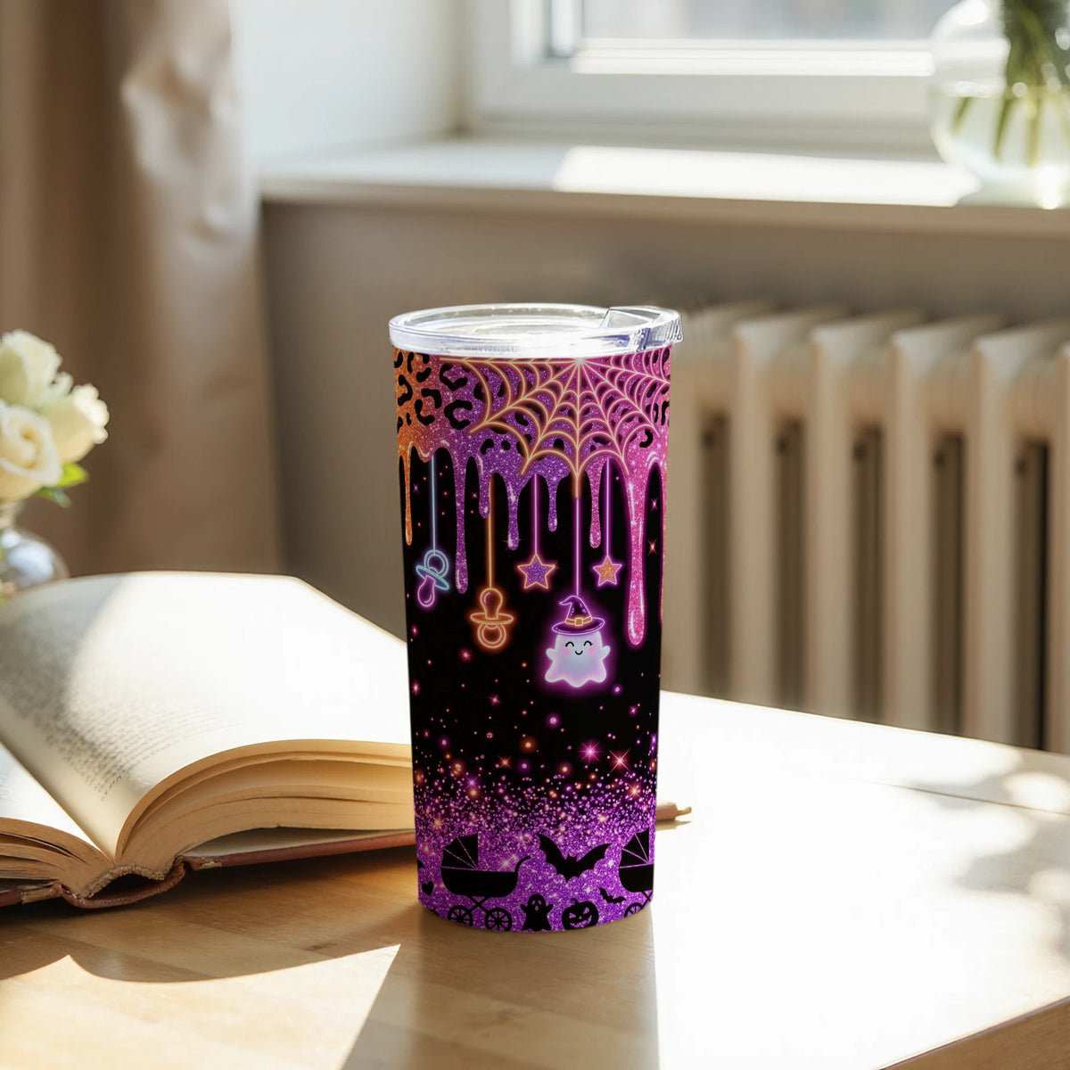 Tumbler with leopard print, spiderwebs, a ghost, and Halloween-themed graphics.