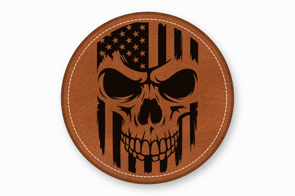 A round brown leather patch with white stitched edges features a black distressed American flag skull graphic.