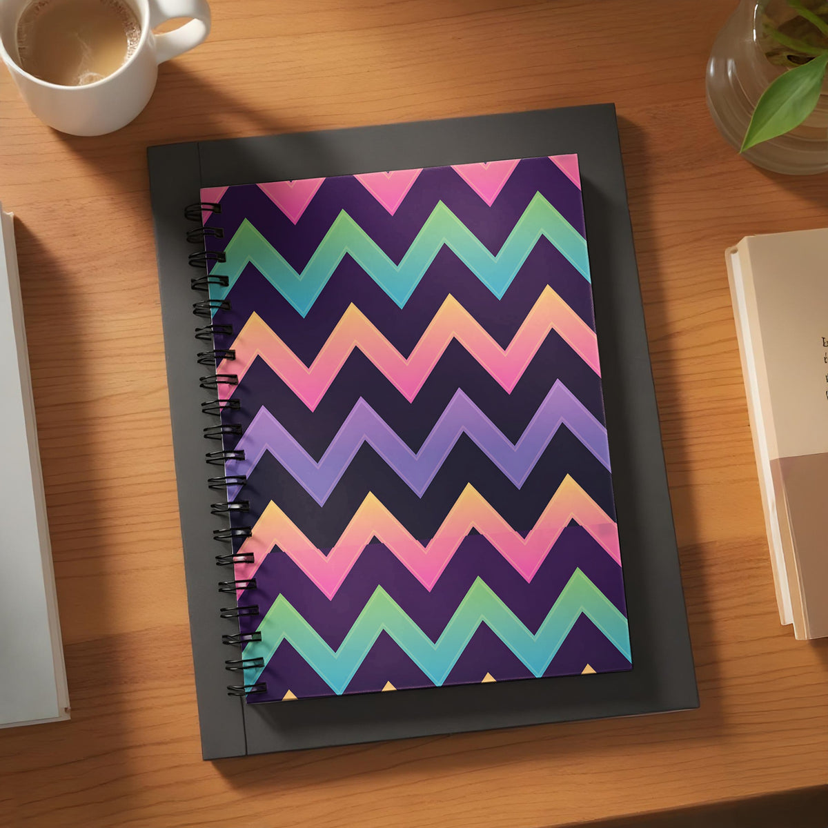 Spiral notebook with colorful chevron pattern on a desk.