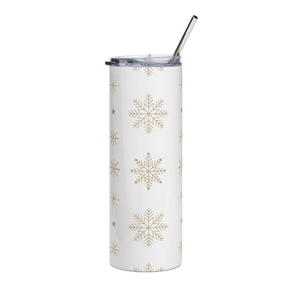 White tumbler with gold snowflake pattern and a silver straw.