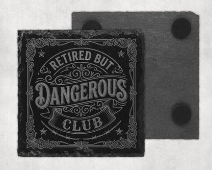 Slate coaster with engraved text "Retired But Dangerous Club".