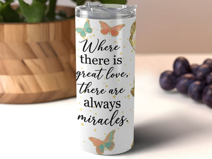 White tumbler with butterflies and text "Where there is great love, there are always miracles."