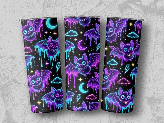 Three tumblers with a glowing neon bat, cloud, and moon pattern.