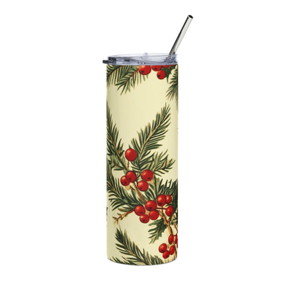Tall tumbler with a vintage holly and pine branch pattern and metal straw.