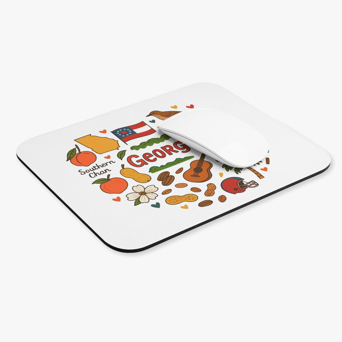 Mousepad with cartoon drawings of Georgia landmarks, peaches, peanuts, guitar, and football helmet.