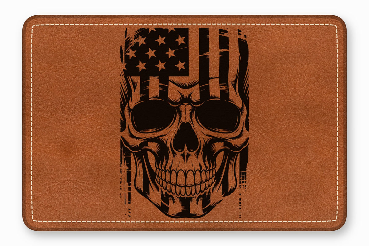 Brown leather patch featuring a black engraved skull overlaid with an American flag design.
