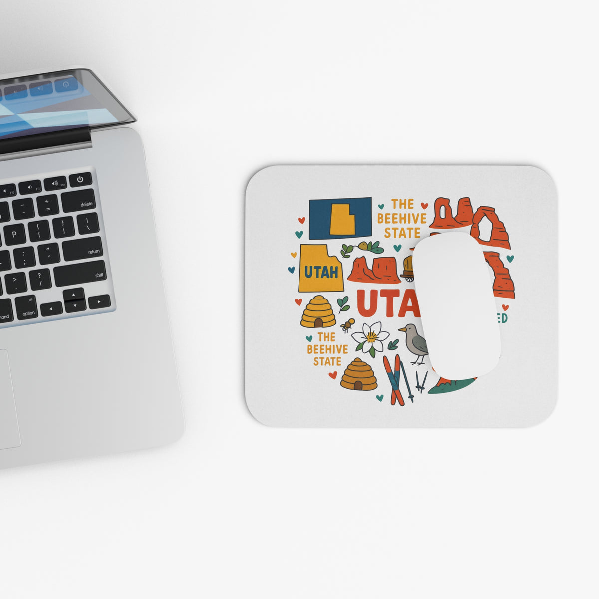 Mousepad with Utah state outline, beehives, arches, and text "Utah The Beehive State."