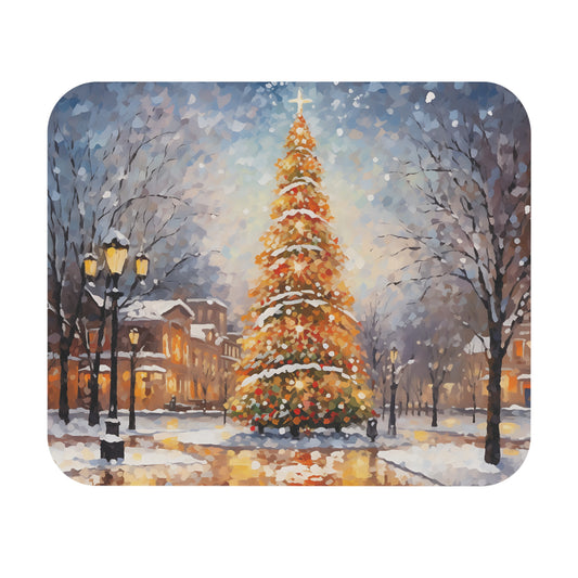 Christmas tree lit up on a snowy street with buildings and lampposts.