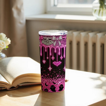 Pink glitter tumbler with dripping hearts, bats, ghosts, and stars pattern.
