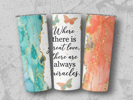 Three tumblers with marble designs and a quote about love and miracles.
