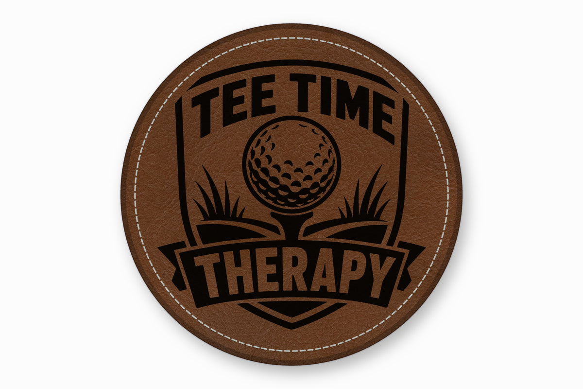 Round brown leather patch with white stitched border, featuring a black golf graphic and the text TEE TIME THERAPY.