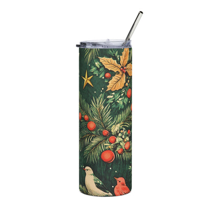 Tall tumbler with Christmas foliage, ornaments, birds, and a metal straw.