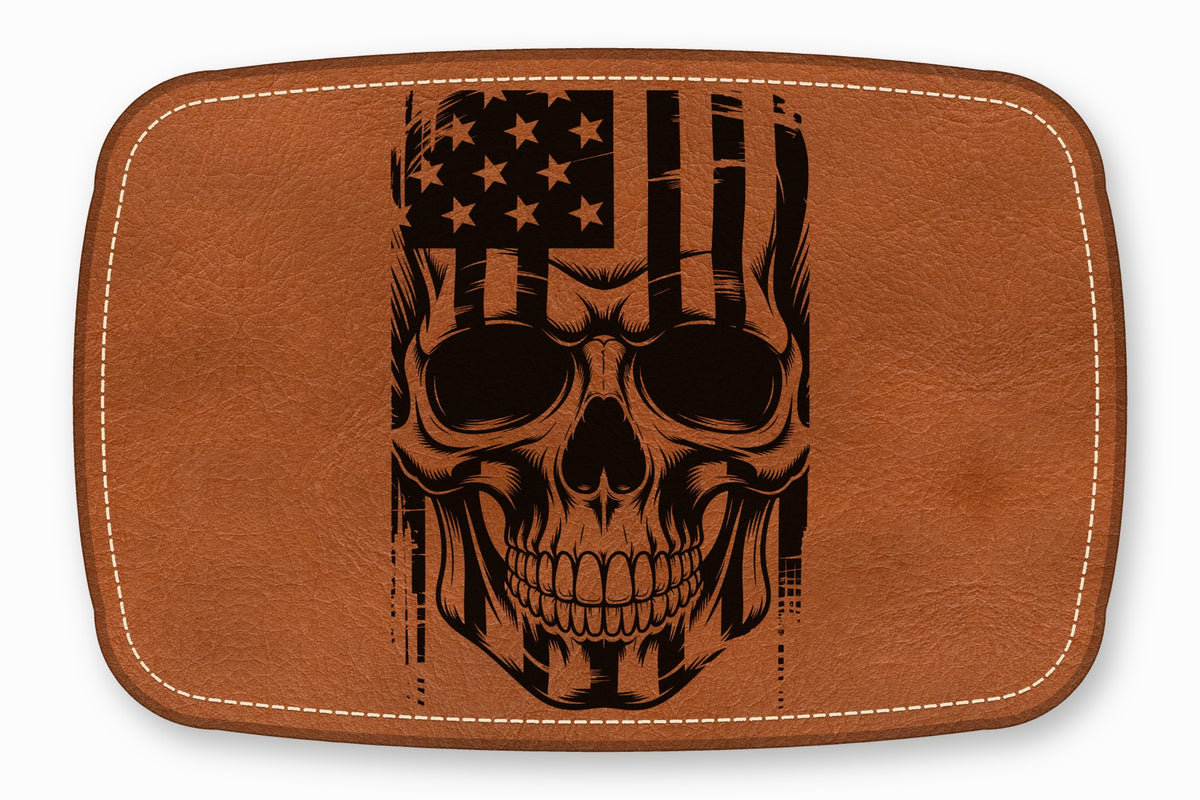 Brown leather patch with rounded corners, white border stitching, and a black skull and American flag graphic.