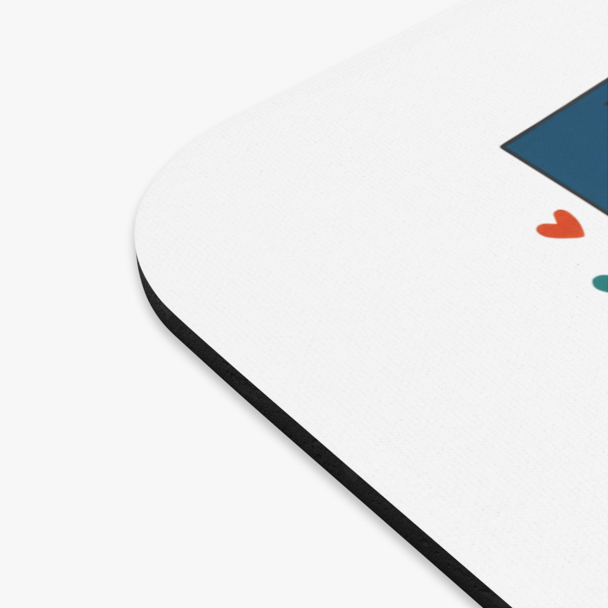 White mousepad with blue geometric design and orange hearts.