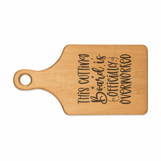 Wooden cutting board with text "THIS CUTTING BOARD IS OFFICIALLY OVERWORKED".