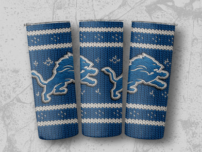 Three tumblers with Detroit Lions logo on a blue knit pattern.