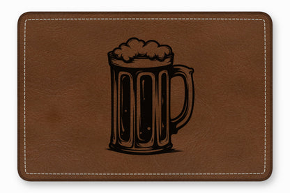 Brown rectangular leather patch with rounded corners and white stitching, featuring a black laser-engraved beer mug.