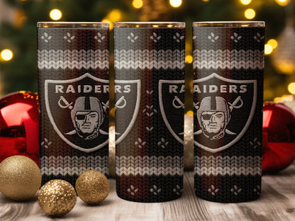 Las Vegas Raiders tumbler with knitted pattern and holiday decorations.
