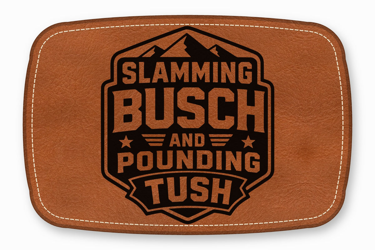 Brown leather patch with white stitching featuring black text that reads Slamming Busch and Pounding Tush.