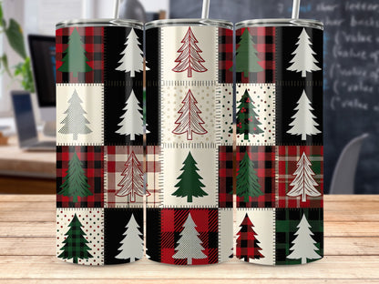 Three tumblers with patchwork designs of Christmas trees and plaid patterns.