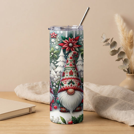 Christmas gnome and poinsettia design on a silver tumbler with a metal straw.