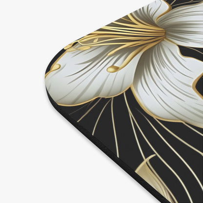 White and gold abstract floral pattern on a black mousepad.