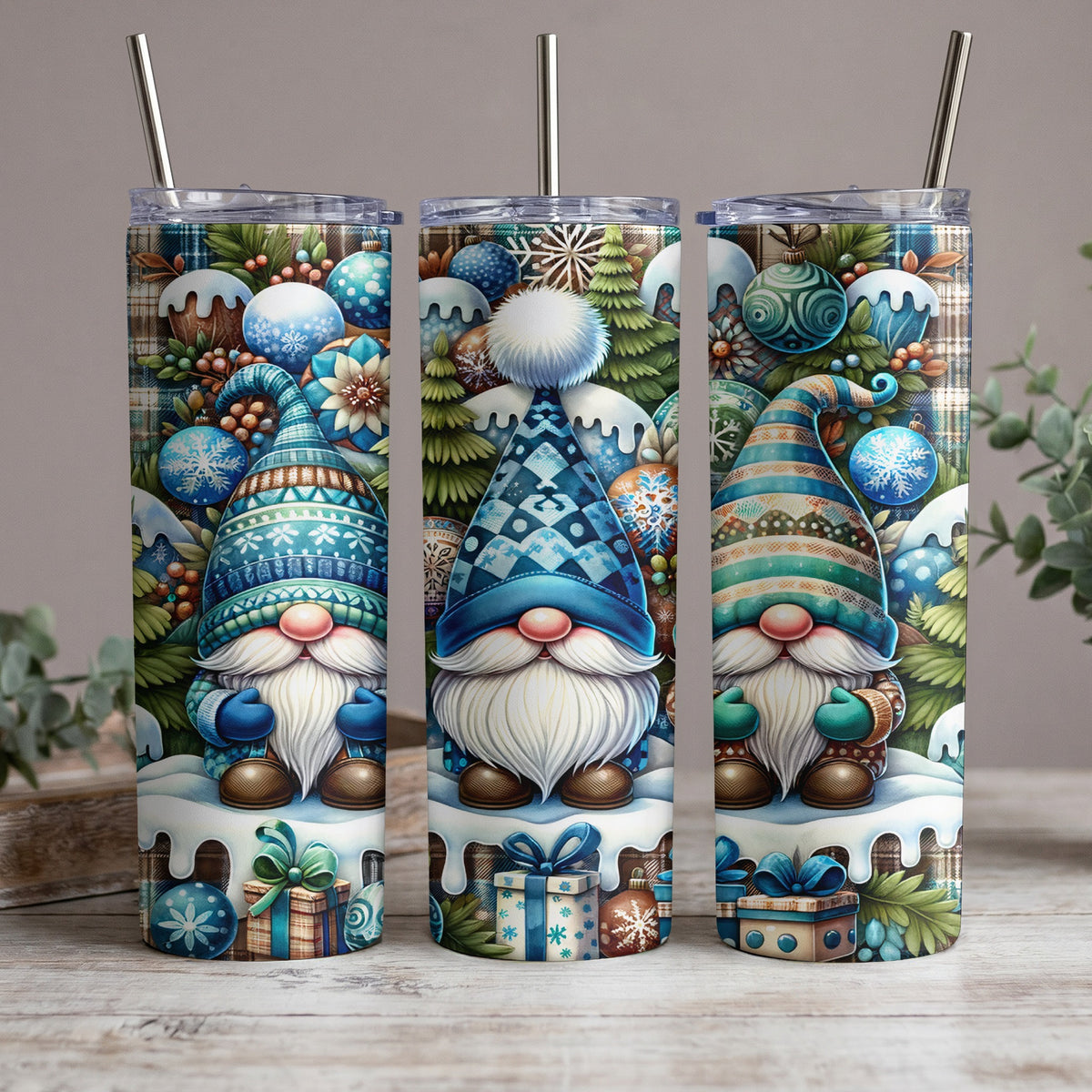 Three tumblers featuring winter gnomes, plaid patterns, ornaments, and gift boxes.