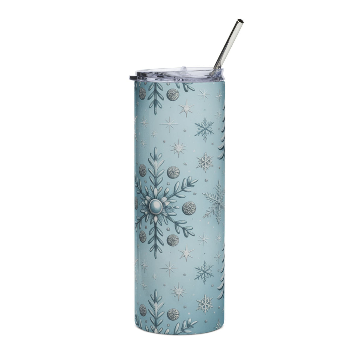 Light blue tumbler with a winter snowflake and pine tree pattern and a metal straw.